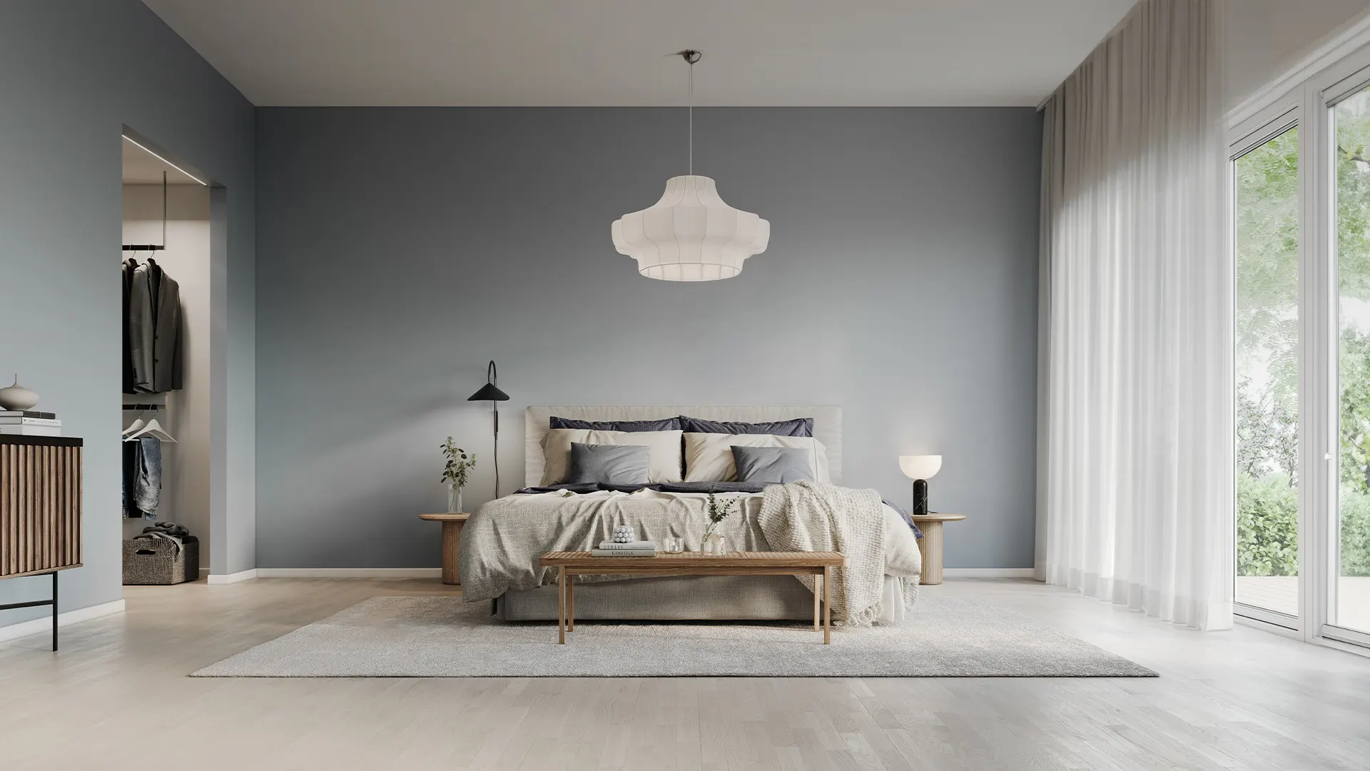 Bright bedroom with a pendant light and a lamp