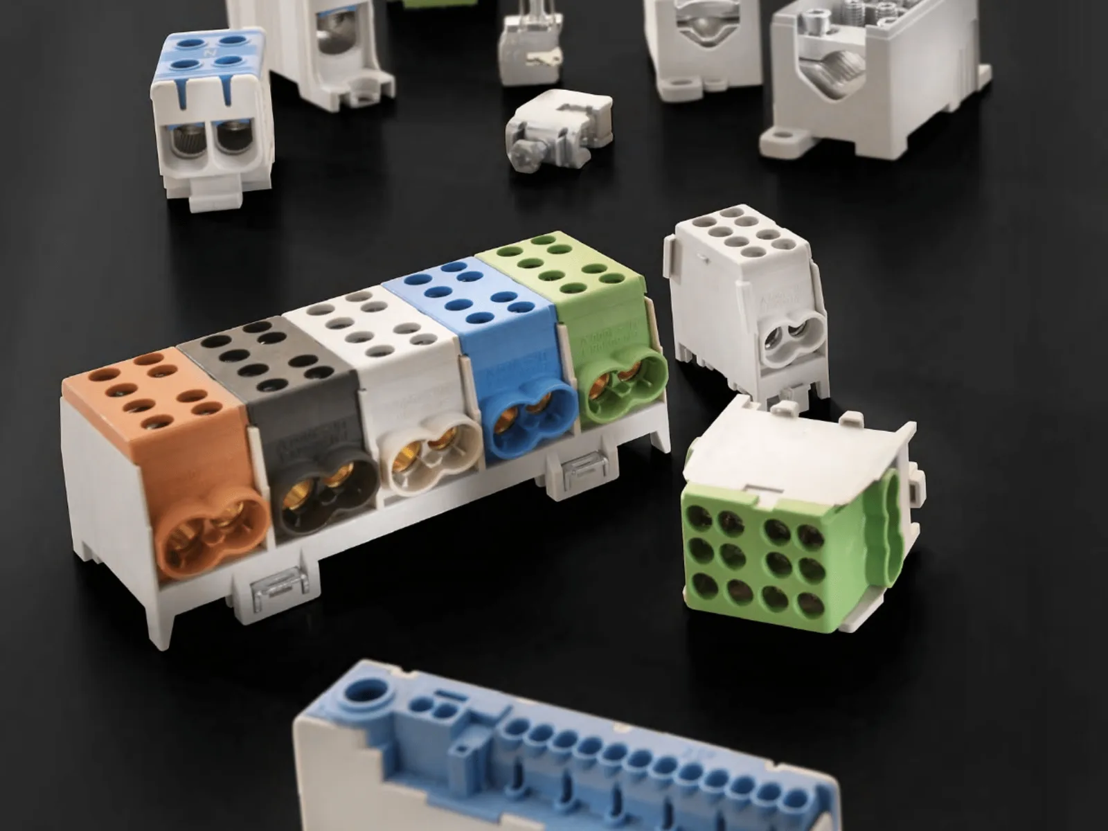 Pollmann branch blocks in grey, blue, green and brown on a dark surface