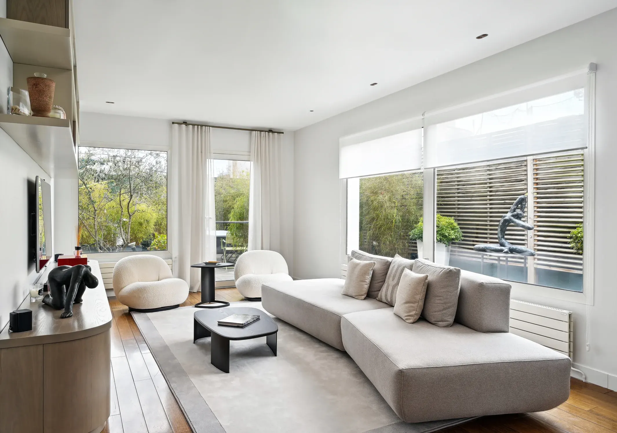 A bright living room with a light sofa and recessed DEEP BIJOU lights in the ceiling